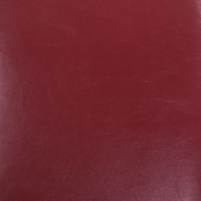 Superfície vermelha em pele ou material sintético com textura rugosa