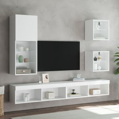 Móvel de sala de estar branco com televisão e decoração