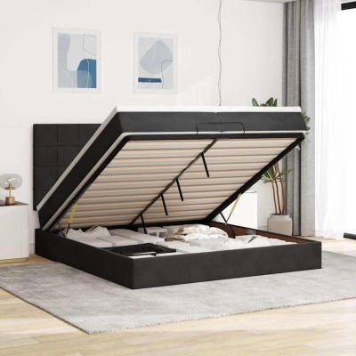 Cama preta com base elevatória aberta e espaço de arrumação interior