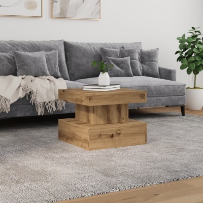 Sofá cinzento, mesa de centro de madeira e tapete cinzento num ambiente interior