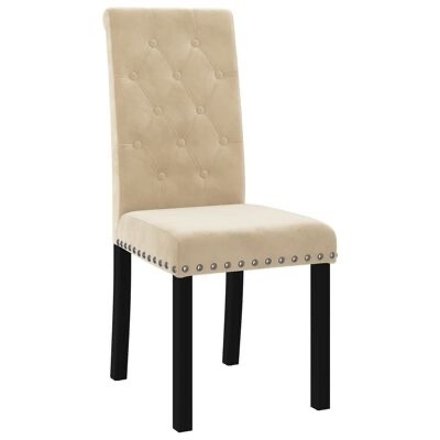 Cadeira estofada de veludo bege com pernas pretas e detalhes metálicos
