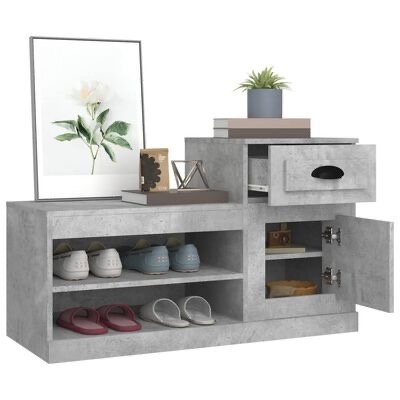 Móvel de arrumação cinza com sapatos, gaveta aberta, porta aberta, livros, planta e quadro de flor branca