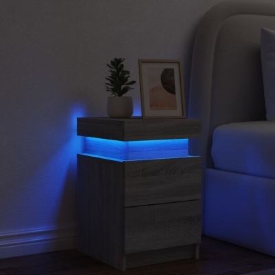 Mesa de cabeceira cinzenta com luz LED azul, vaso e quadro junto a cama