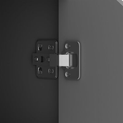 Dobradiça metálica prateada fixada em superfícies cinzentas