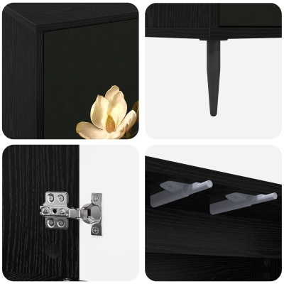 Detalhes de móvel preto com padrão floral, pernas pretas e dobradiças metálicas