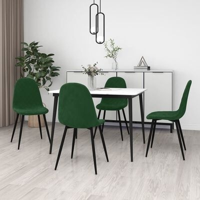Conjunto de mesa branca com cadeiras estofadas verdes numa sala com chão de madeira clara e decoração moderna