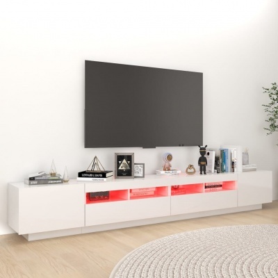 Móvel TV branco com iluminação vermelha, TV preta na parede branca e decoração variada