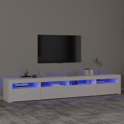 Móvel TV branco com iluminação azul e televisão montada na parede numa sala minimalista.