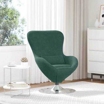 Cadeira de veludo verde escuro com base metálica numa sala com mesa branca e planta suculenta