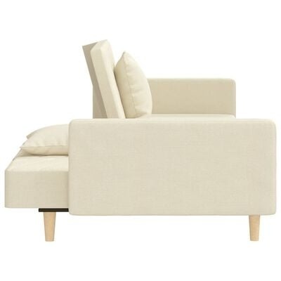 Sofá beige claro com almofadas e pés de madeira