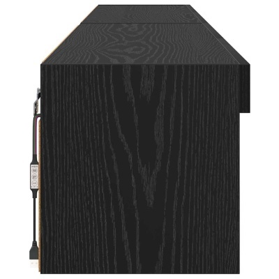 Secretária ou bancada preta em madeira com cabo USB e controlador na lateral.