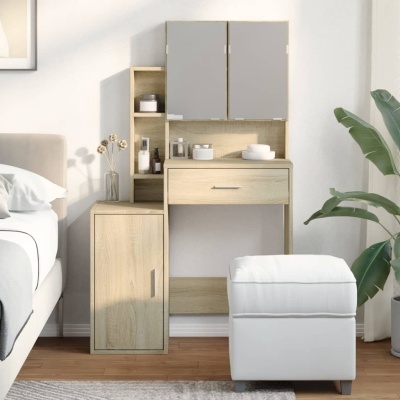 Móvel claro com espelho triplo e banco branco numa sala com chão de madeira e planta verde