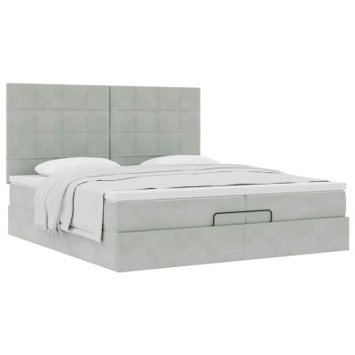 Cama estofada cinzento claro com cabeceira quadrada e manta branca dobrada
