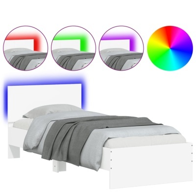 Cama individual branca com roupa de cama em tons de cinza e luz LED colorida ajustável atrás da cabeceira