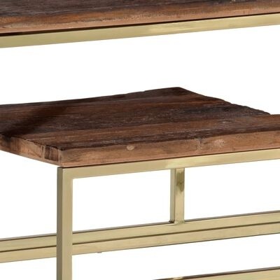Mesa de madeira escura com estrutura metálica dourada