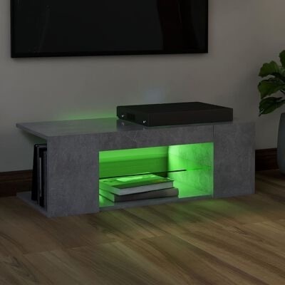 Mesa de centro cinza com iluminação verde e livros empilhados