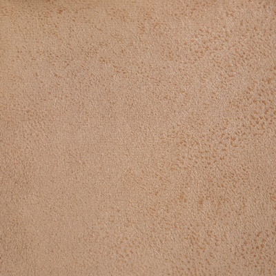 Textura de pele bege claro com pequenas marcas e poros visíveis