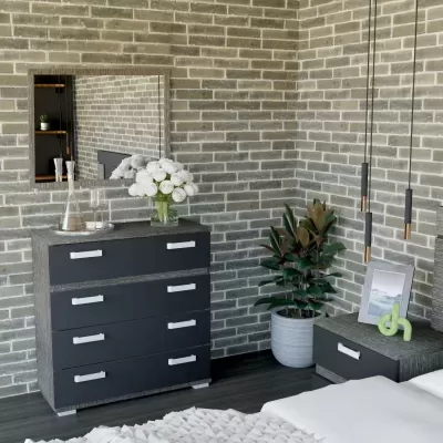 Mobiliário de quarto cinzento escuro com cómoda, mesa de cabeceira, espelho, planta e decoração