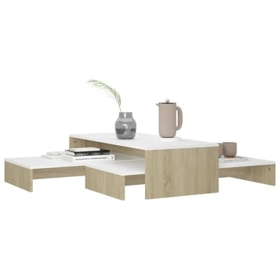 Mesa de centro modular em madeira clara com tampo branco e decoração
