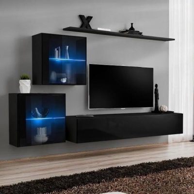 Conjunto moderno de móveis pretos com iluminação LED azul numa sala de estar