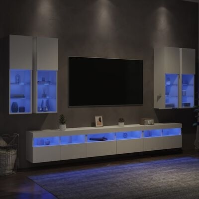 Móveis modernos de sala brancos com iluminação azul e televisão montada na parede