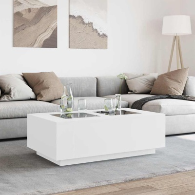 Mesa de centro branca de design moderno numa sala com sofá cinza e almofadas bege