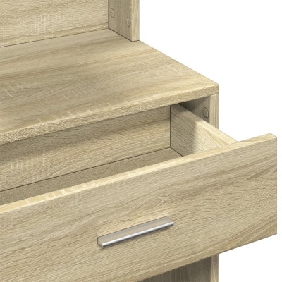 Gaveta aberta de móvel em madeira clara com puxador metálico prateado