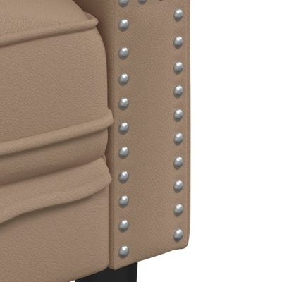 Detalhe de móvel estofado castanho claro com tachas metálicas e pés pretos