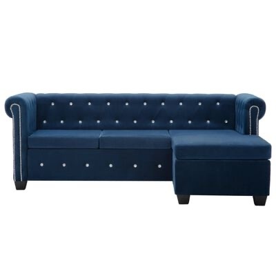 Sofá chaise longue azul escuro com botões e detalhes prateados
