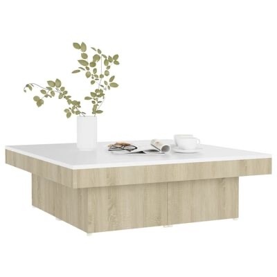 Mesa de centro quadrada com tampo branco e base em madeira clara com objetos decorativos