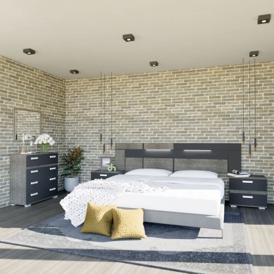 Quarto moderno com cama cinza escura, roupa branca, almofadas amarelas e parede de tijolos claros