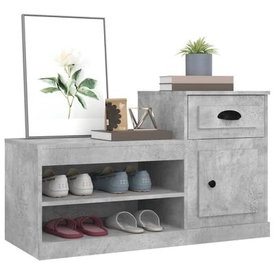 Móvel organizador cinza com sapatos, gaveta, porta, moldura com flor, livros e planta