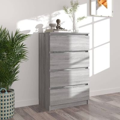 Cómoda cinza de quatro gavetas com decoração e planta ao lado