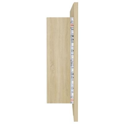 Estante de parede em madeira clara com fita métrica visível na lateral
