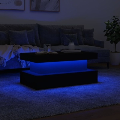 Mesa de centro preta iluminada com LED azul numa sala com sofá cinza e planta.