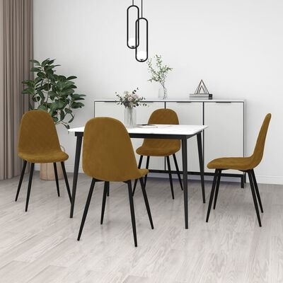Conjunto de mesa e cadeiras amarelo mostarda com pernas pretas, aparador branco e planta em ambiente interior.