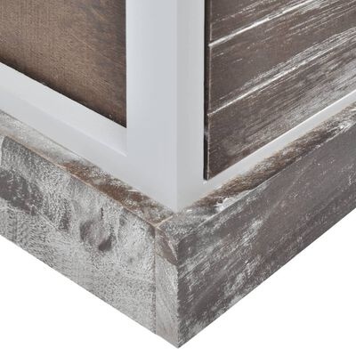 Canto inferior de móvel de madeira com acabamento rústico cinzento e molduras brancas