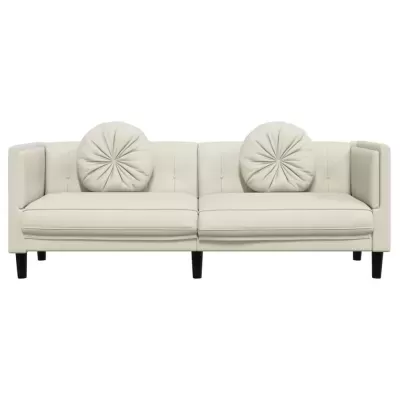 Sofá bege de pele sintética com almofadas redondas decorativas