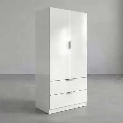 Guarda-roupa branco com duas portas e duas gavetas, chão e parede cinzentos
