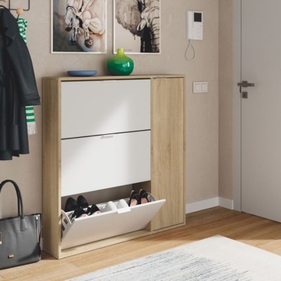 Móvel de sapatos moderno em madeira clara e branco num ambiente interior com decoração neutra.