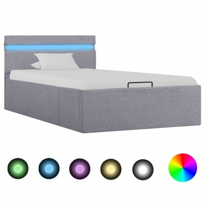 Cama estofada cinza com cabeceira luminosa azul e colchão branco