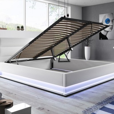 Cama branca estofada com armazenamento e luz LED, em quarto moderno cinzento com vaso e quadro abstrato