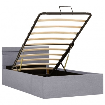 Cama caixa cinza com sistema elevatório e arrumação