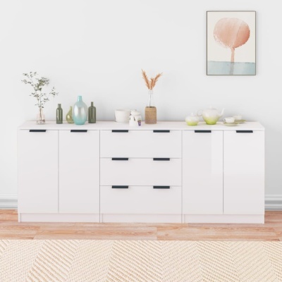 Aparador branco com decoração e quadro abstrato na parede