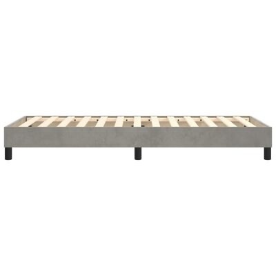 Estrado de cama em madeira com estrutura em tecido cinza e ripas visíveis
