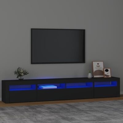 Móvel de TV preto com iluminação azul, decoração com vasos e molduras, parede cinzenta e tapete cinzento