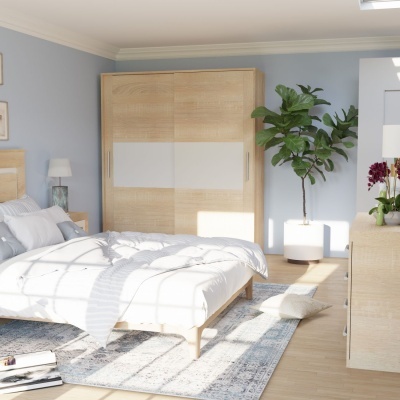 Quarto com cama, guarda-roupa, cómoda, planta e decoração em tons claros e azul