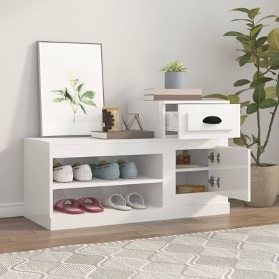 Móvel branco de entrada com gaveta, porta e nichos com sapatos, decoração e planta em sala clara