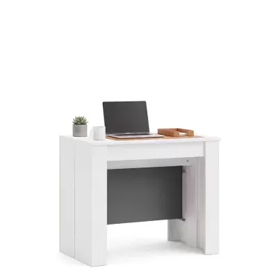 Mesa de escritório branca com acessórios incluindo laptop e planta