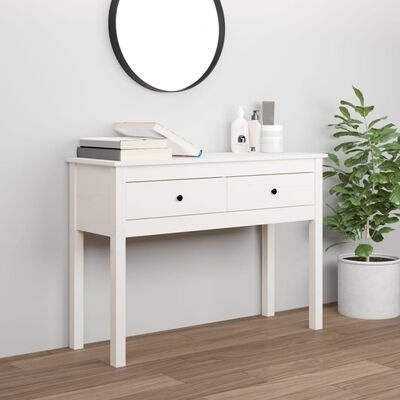 Móvel de entrada branco com gavetas e decoração incluindo espelho redondo e planta em vaso